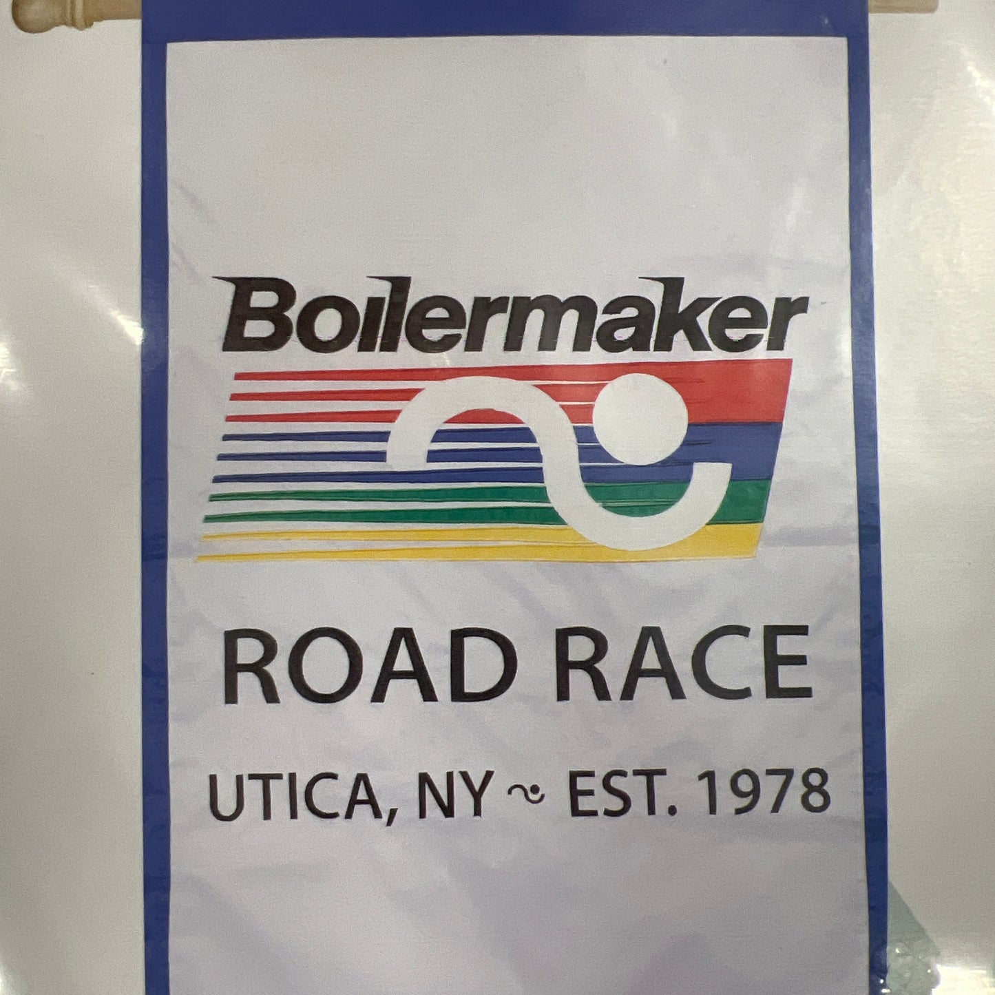 A house flag with the Boilermaker logo and text 'ROAD RACE UTICA, NY – EST. 1978' displayed on it.